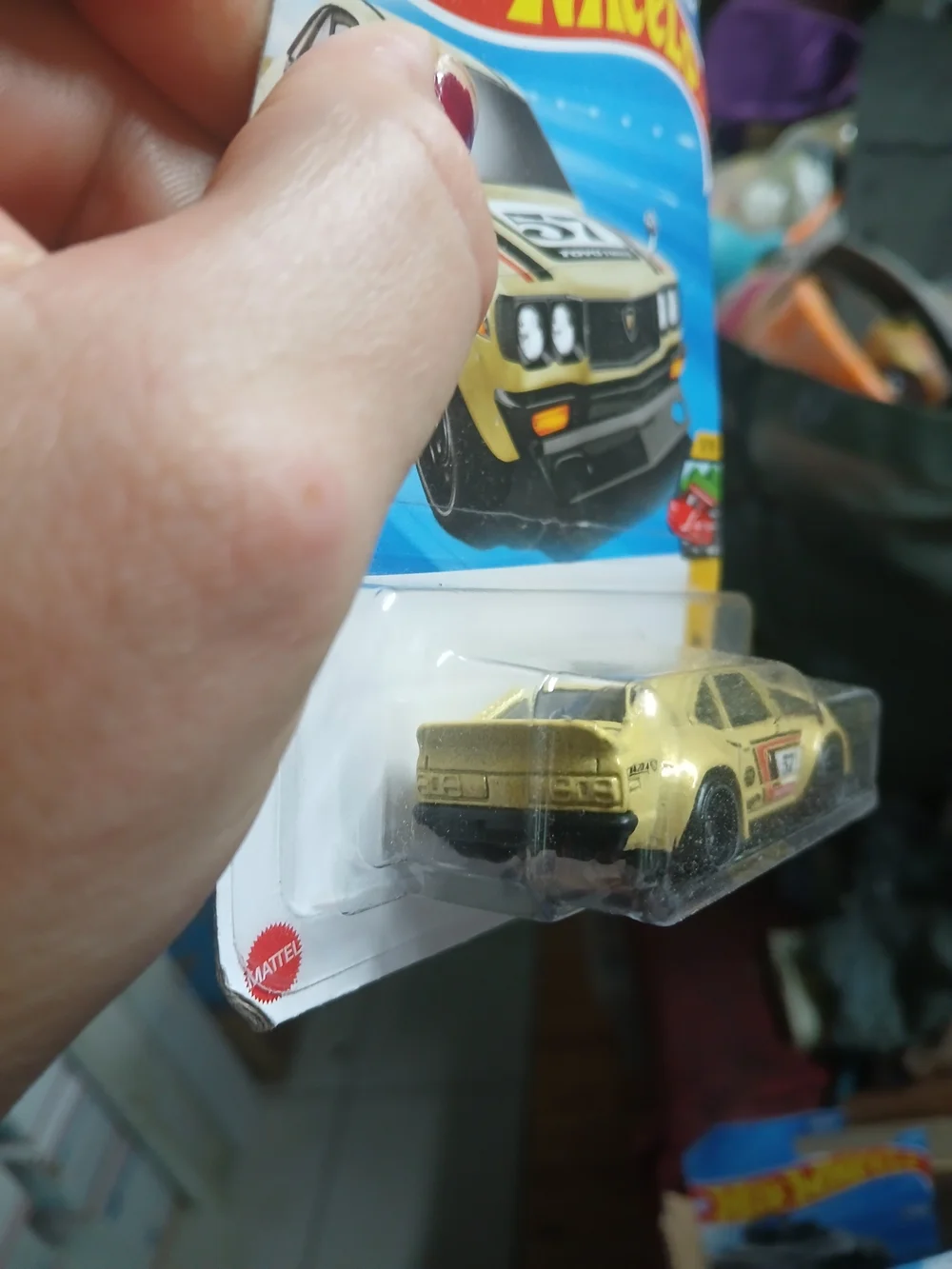 1:64 scale die-cast yellow Mazda RX-3 from the Hot Wheels Peak Pursuit series (n